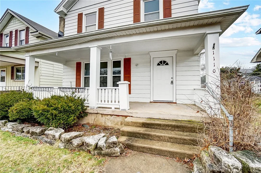 After: Renovated exterior of 1110 Arbor Ave, Dayton OH — fresh paint and curb appeal